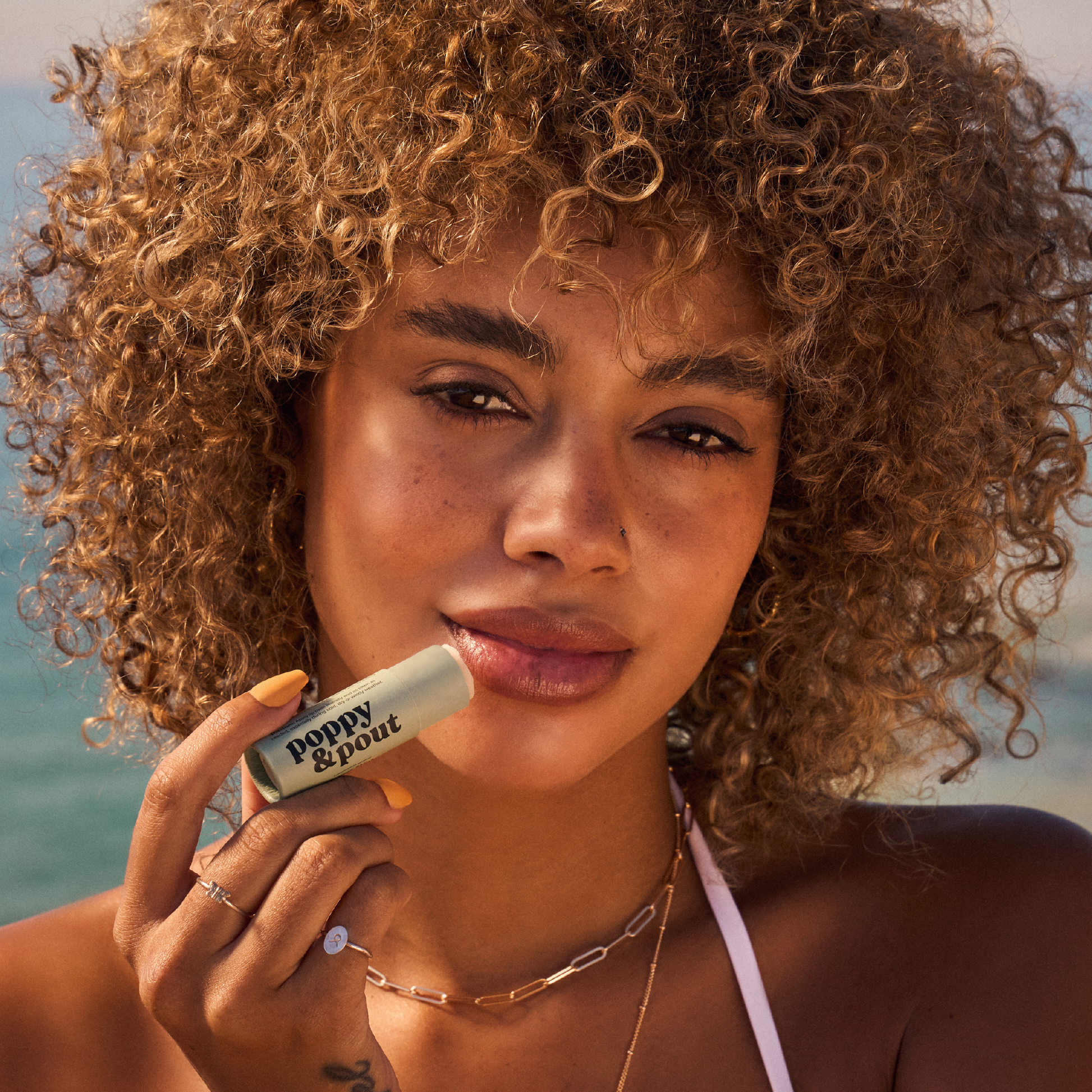 Poppy & Pout Sweet Mint Lip Balm with model 2